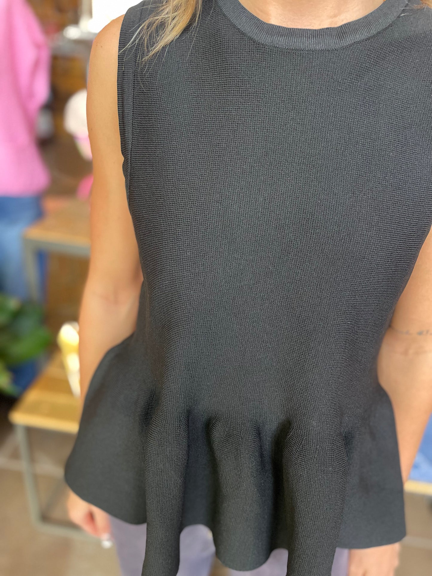 BLACK SLEEVELESS PEPLUM TOP