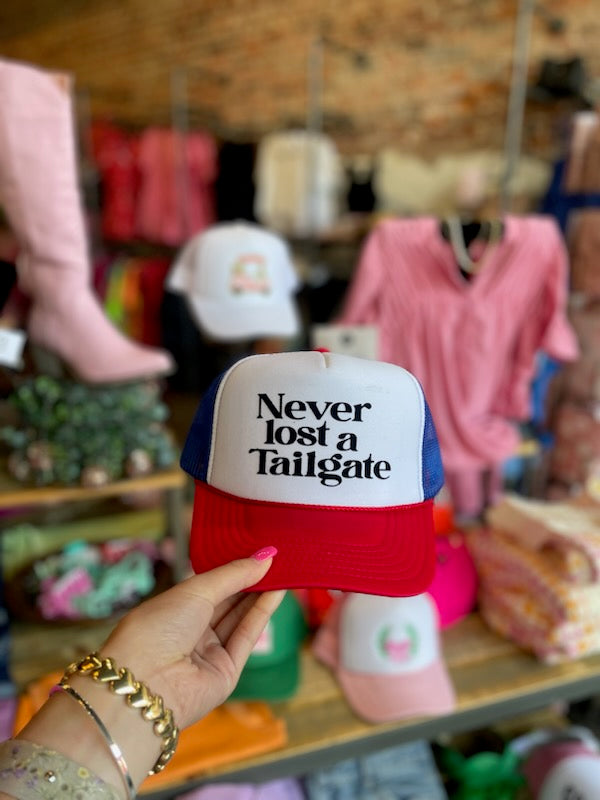 NEVER LOST A TAILGATE TRUCKER HAT