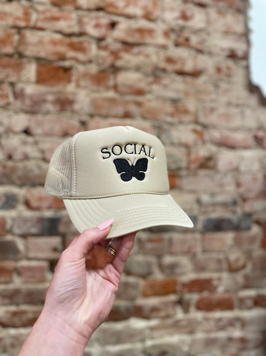 SOCIAL BUTTERFLY TAN TRUCKER HAT