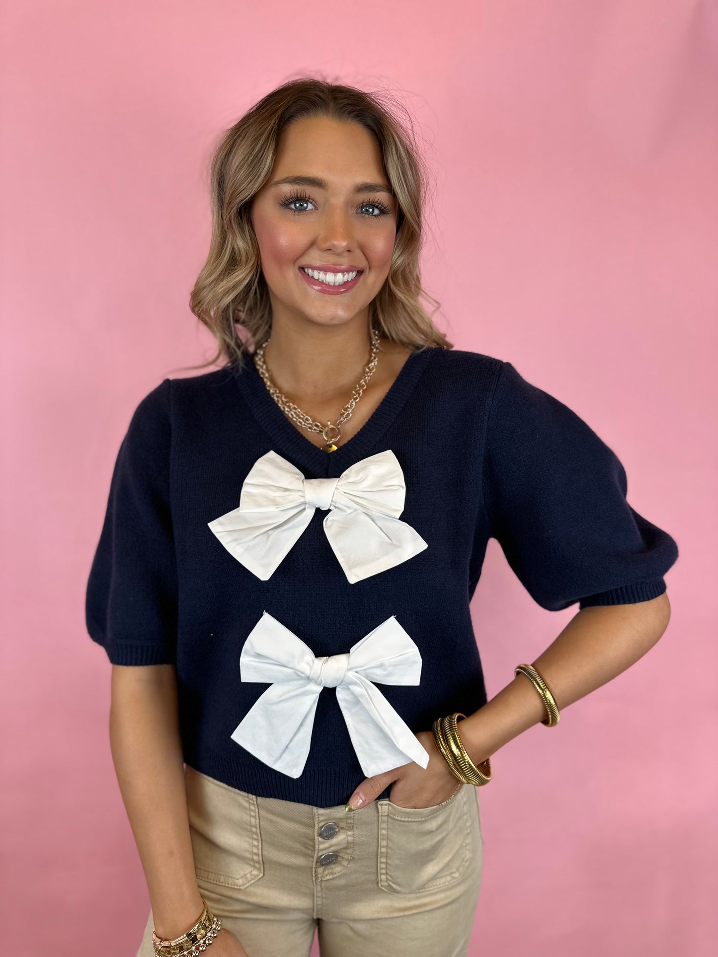 NAVY BOW SWEATER TOP