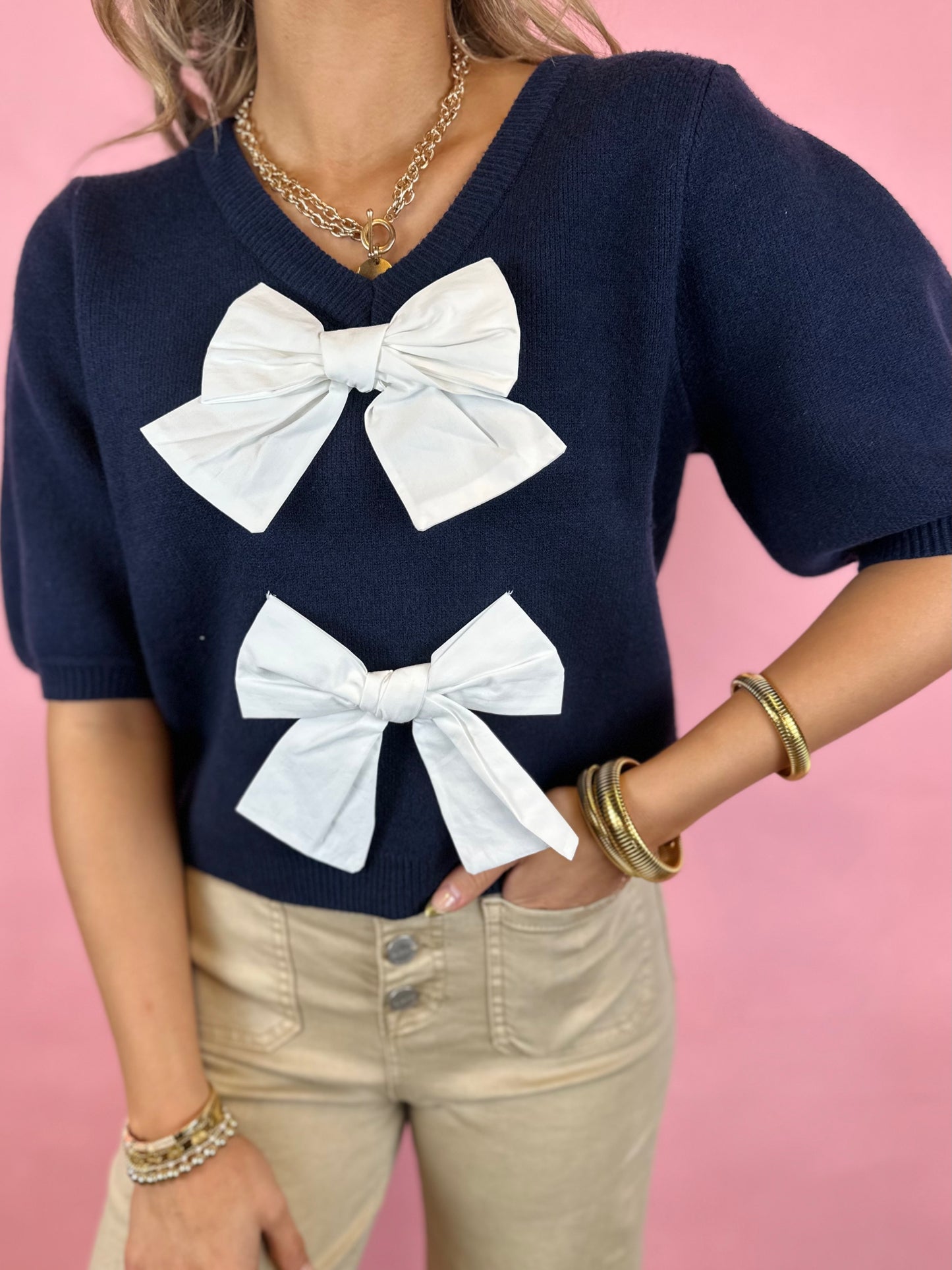 NAVY BOW SWEATER TOP