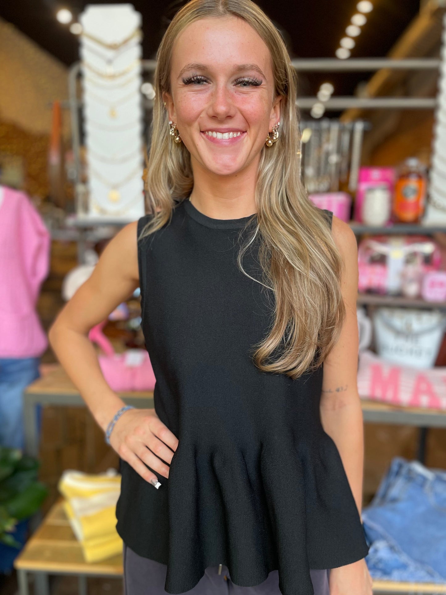 BLACK SLEEVELESS PEPLUM TOP