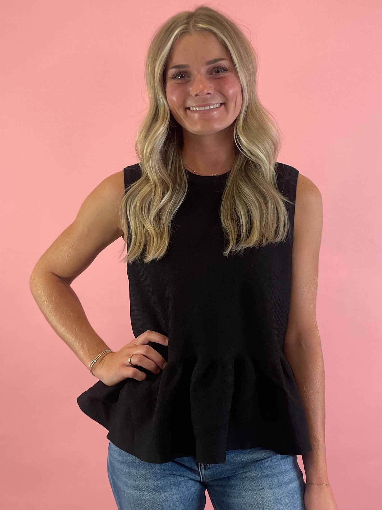 BLACK SLEEVELESS PEPLUM TOP